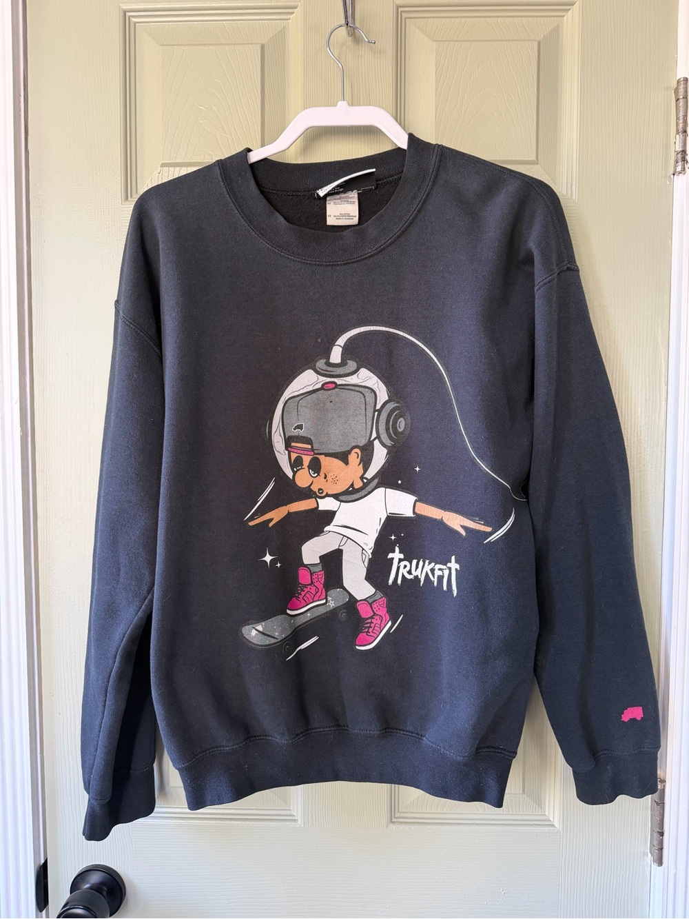 Trukfit Black Sweatshirt with Pink Graphic Skateboard Design